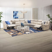 Ambassador Electric Motion Lounge Suite in cream leather with blue accent pillows and reclining seats for comfortable