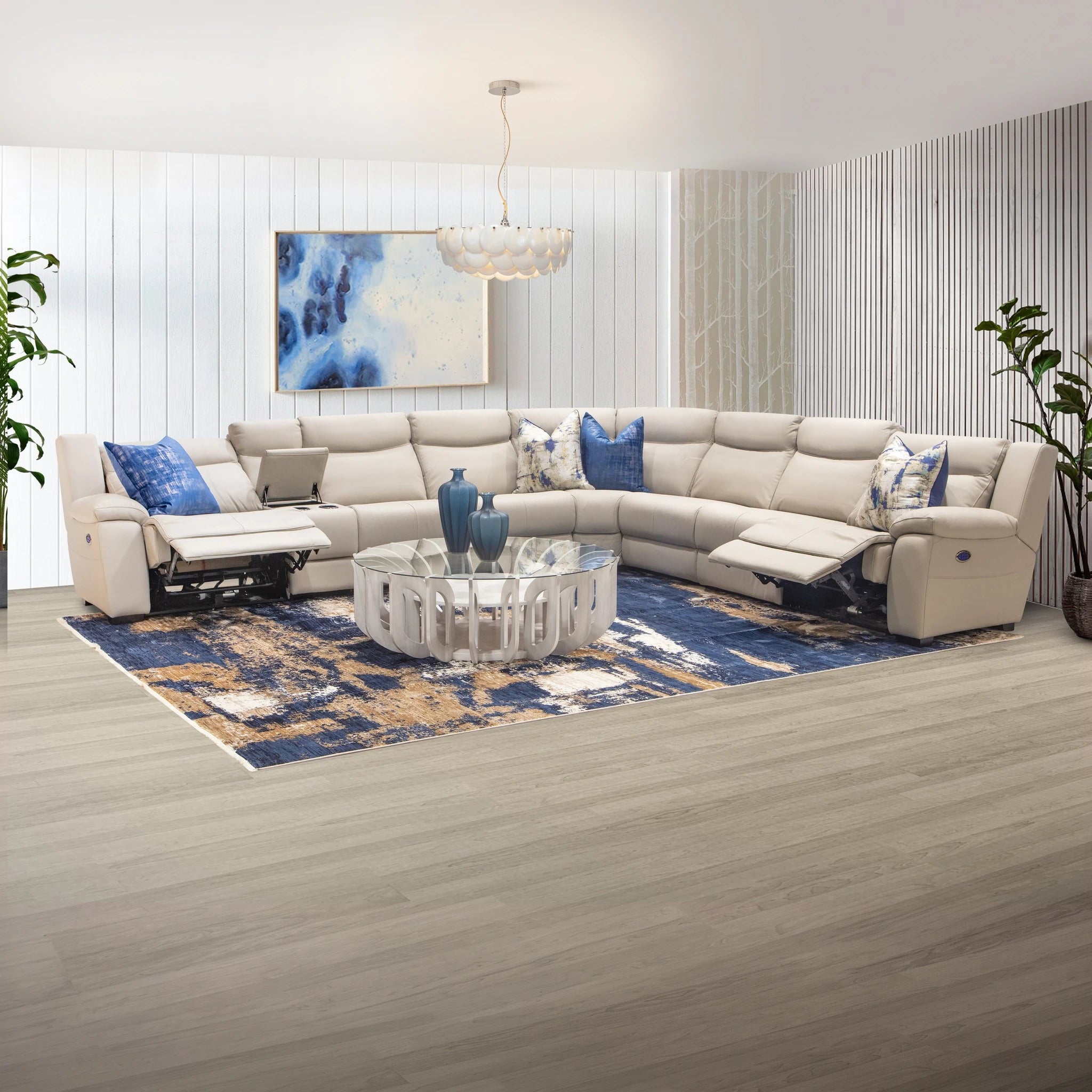 Ambassador Electric Motion Lounge Suite in cream leather with blue accent pillows and reclining seats for comfortable