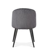 Blaze Dining Room Chair with grey ribbed upholstered backrest and slender black tapered metal legs, viewed from the back.