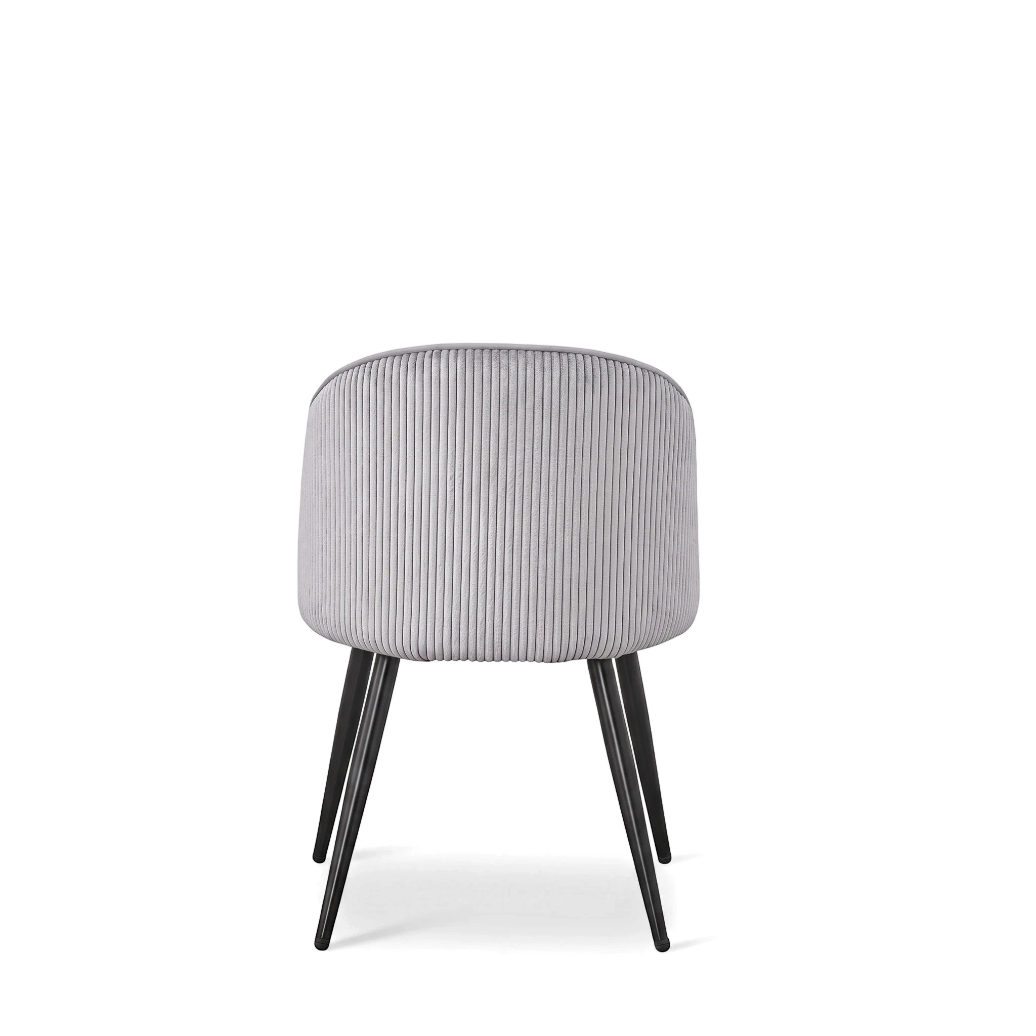 Blaze dining room chair in grey ribbed velvet with black tapered legs, shown from the back.