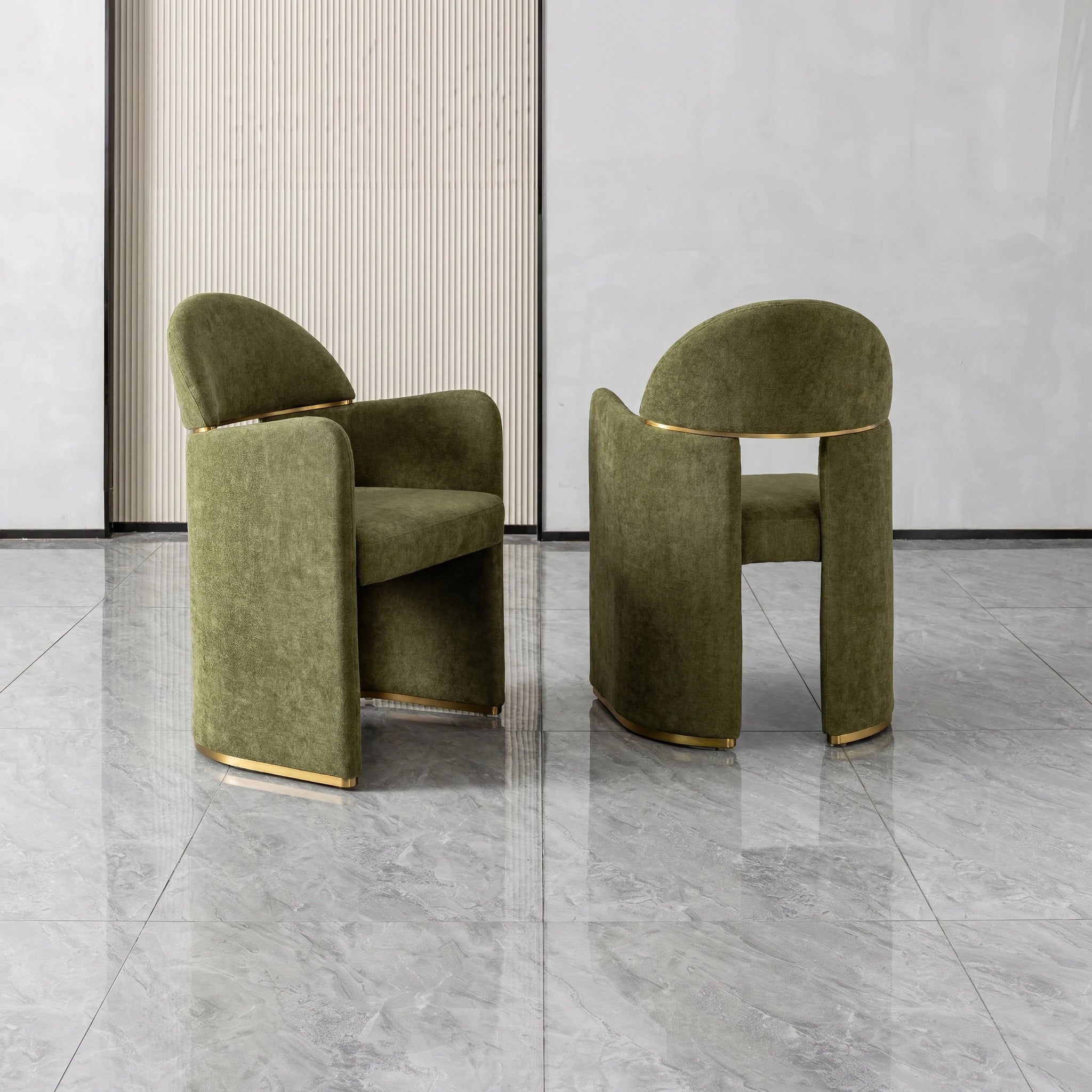 Bodrum dining room chair in olive green velvet with a curved back and gold metal base, showcasing a modern, sculpted