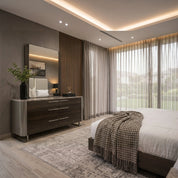 Cassino dressing table and mirror in black oak finish with metal handles, showcased in a modern bedroom setting.