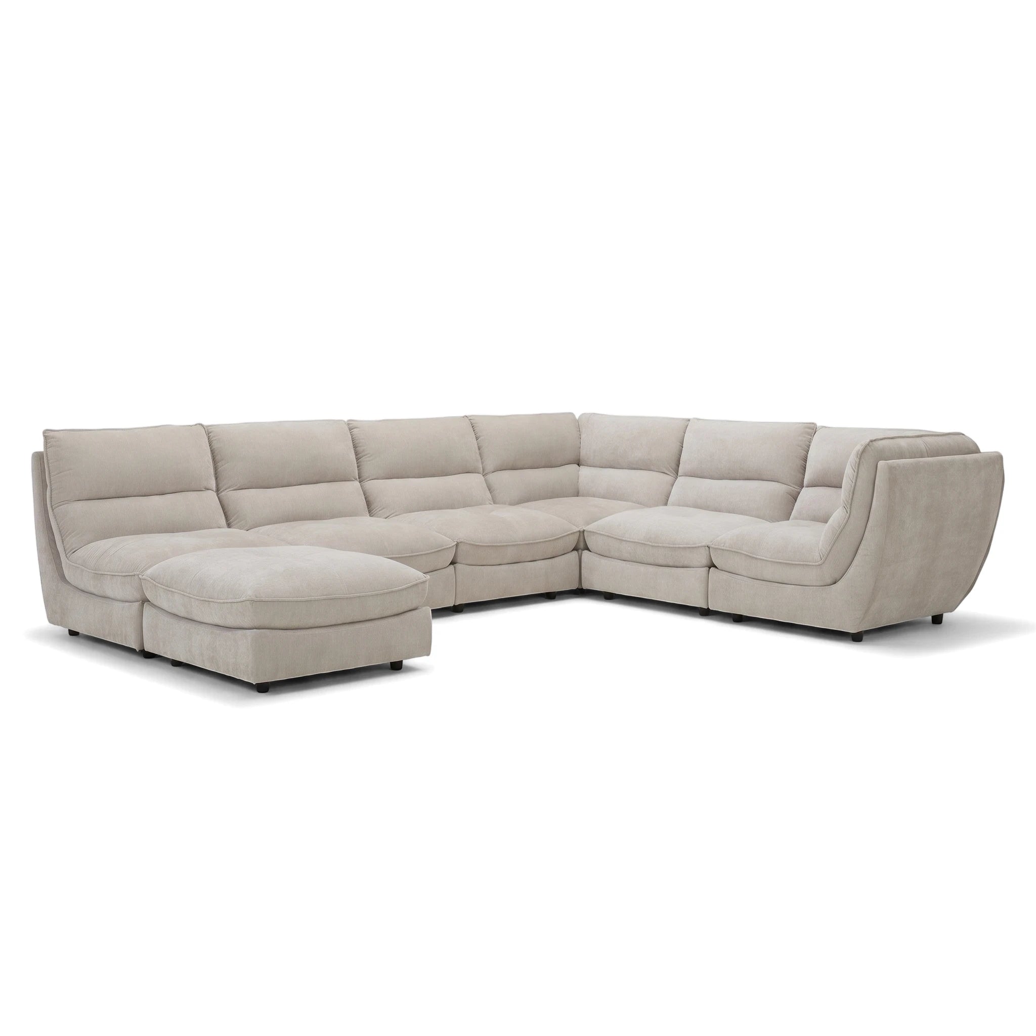Light beige fabric upholstered L-shaped Chagall MK2 Modular Lounge Suite with ottoman, viewed from the front-right.