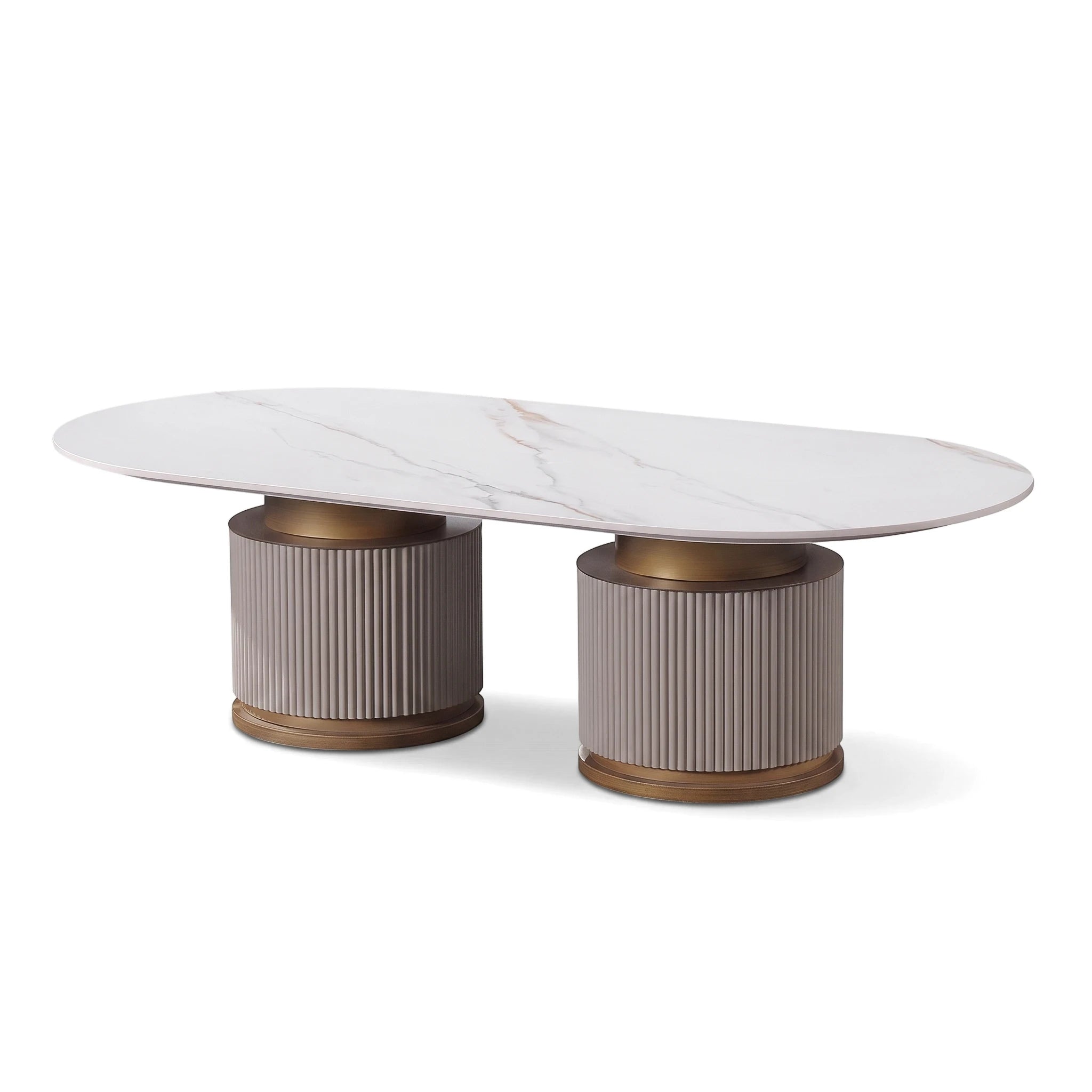 Chandler coffee table with an oval white marble top and two fluted gray-beige bases with bronze accents.