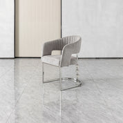 Cristallo dining chair in light gray velvet with vertical channel back and chrome cantilever base.