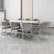 Cristallo dining table with white marble oval top and polished chrome pedestal base.