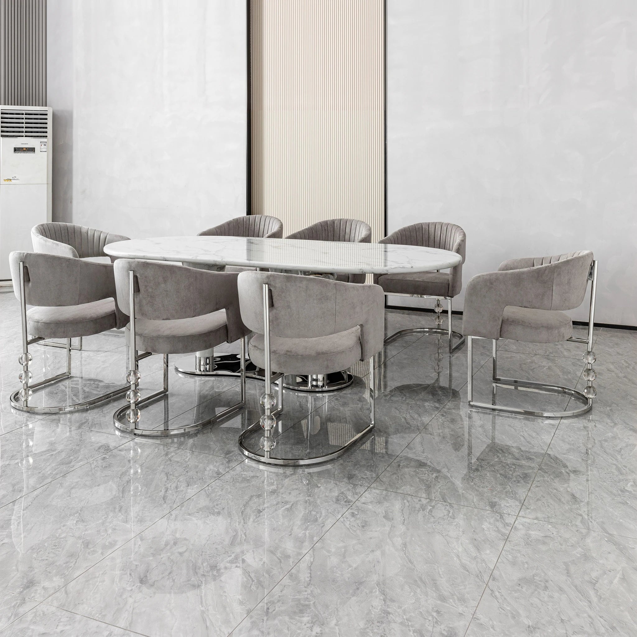 Cristallo dining table with white marble oval top and polished chrome pedestal base.
