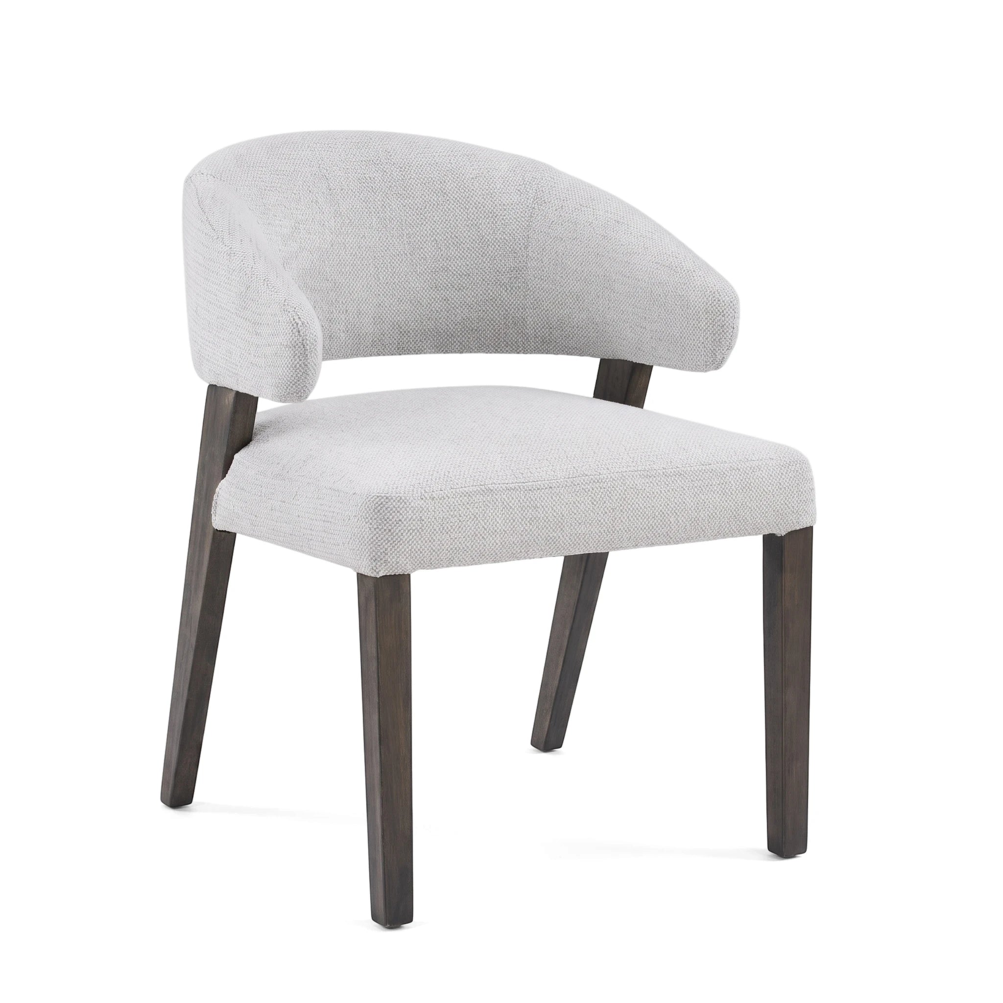 Contemporary Delphi dining room chair upholstered in light grey fabric with dark wooden legs, shot from a slightly elevated