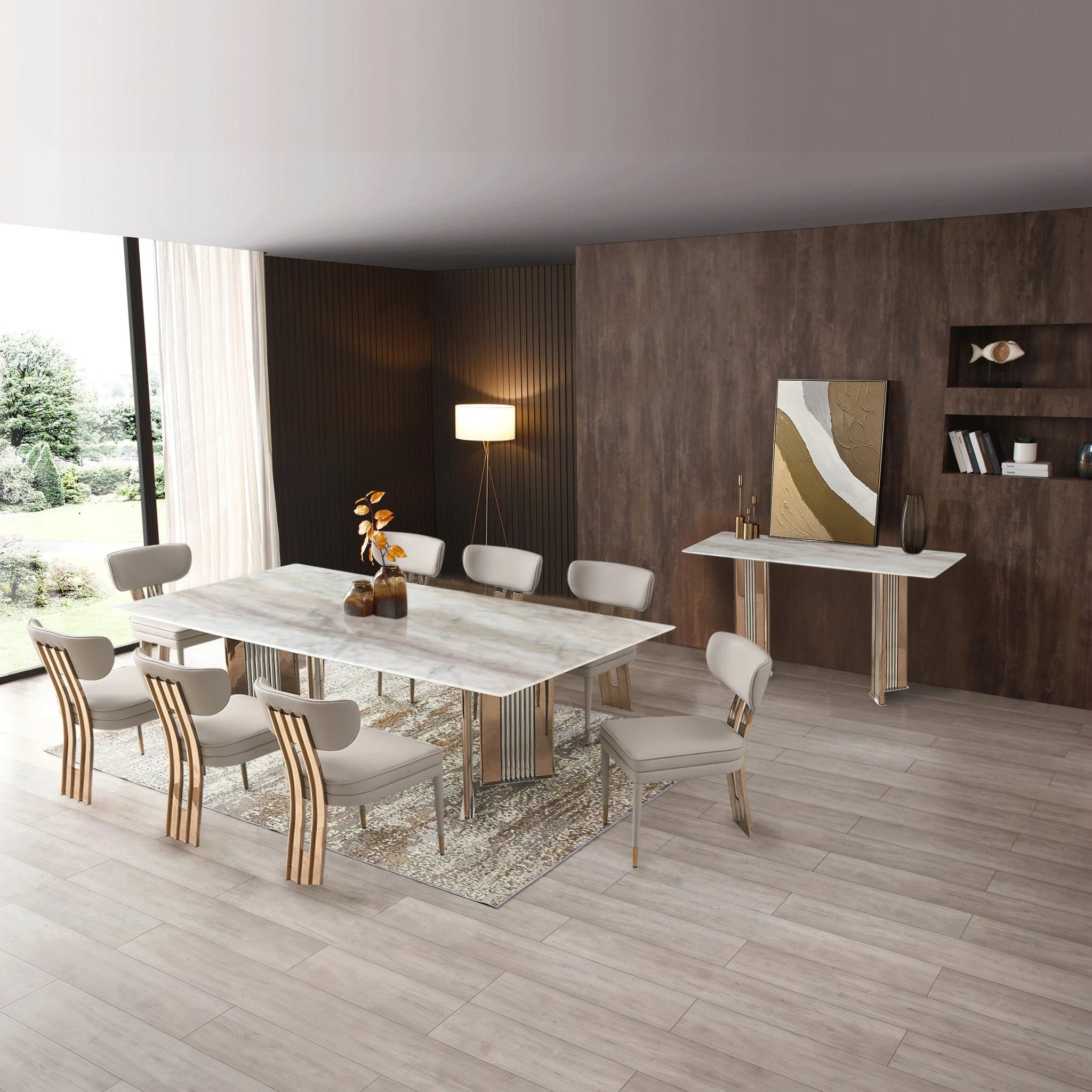 Fortino Dining Room Table with white marble top and gold-tone pedestal legs, showcased in a modern dining space.