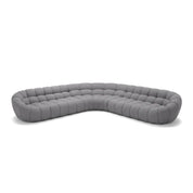 Gray curved tufted Bubble Sofa sectional, a modern and comfortable furniture piece for a contemporary living room setting.
