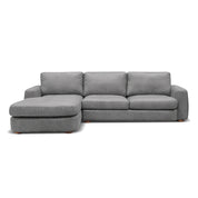 Front view of a grey fabric Hickory L-Shape Lounge Suite, featuring a chaise on the left and exposed wooden feet.