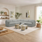 Le Mans Corner Lounge Suite in light gray fabric, a spacious modular sectional shown in a bright living room with beige