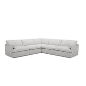 Light grey fabric Le Mans Corner Lounge Suite, L-shaped sectional sofa with plush cushions and block arms, viewed from the