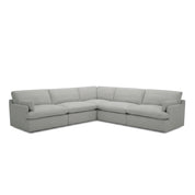 A light grey L-shaped fabric Le Mans Corner Lounge Suite shown from a front-angle view, perfect for living rooms.