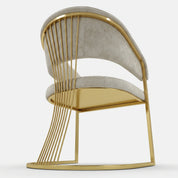Marcello Dining Room Chair with light gray upholstered seat and curved back, side view with gold metal frame.