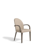 Montpellier Dining Room Chair with beige upholstered seat and back, dark wooden frame, and armrests, viewed from an angle.