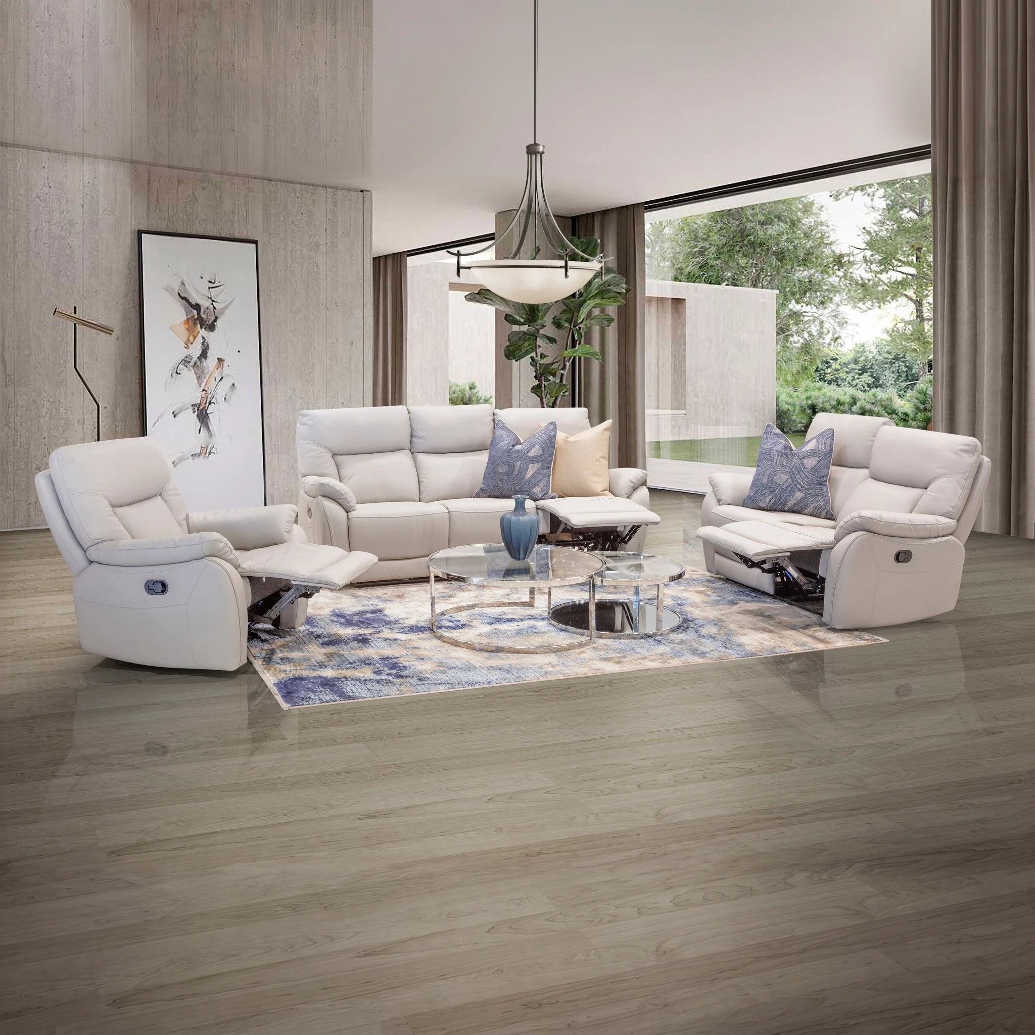 Pacific 5 Action Recliner Lounge Suite in cream leather with reclining seats and blue patterned pillows, modern living room