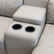 Perissa Corner Lounge Suite Grey 5Pc close-up of grey upholstered armrest console with two built-in cup holders