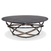 Peyton Coffee Table with a round dark glass top and intertwining dark metallic base, shot from a slightly elevated angle.