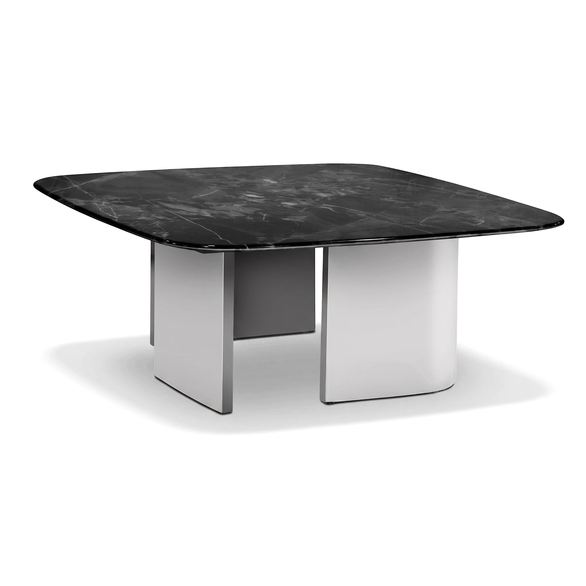 Modern Rovigo coffee table featuring a dark marble top and sturdy white block legs, viewed from an angled perspective.