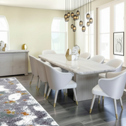 Tazmyn 9 Piece Dining Room Suite in grey oak with a marble-like tabletop and modern upholstered chairs.